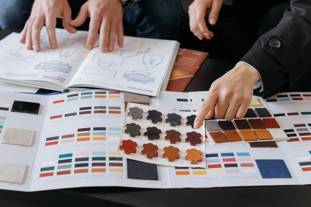 Home Designers reviewing color swatches and sketches for project planning.